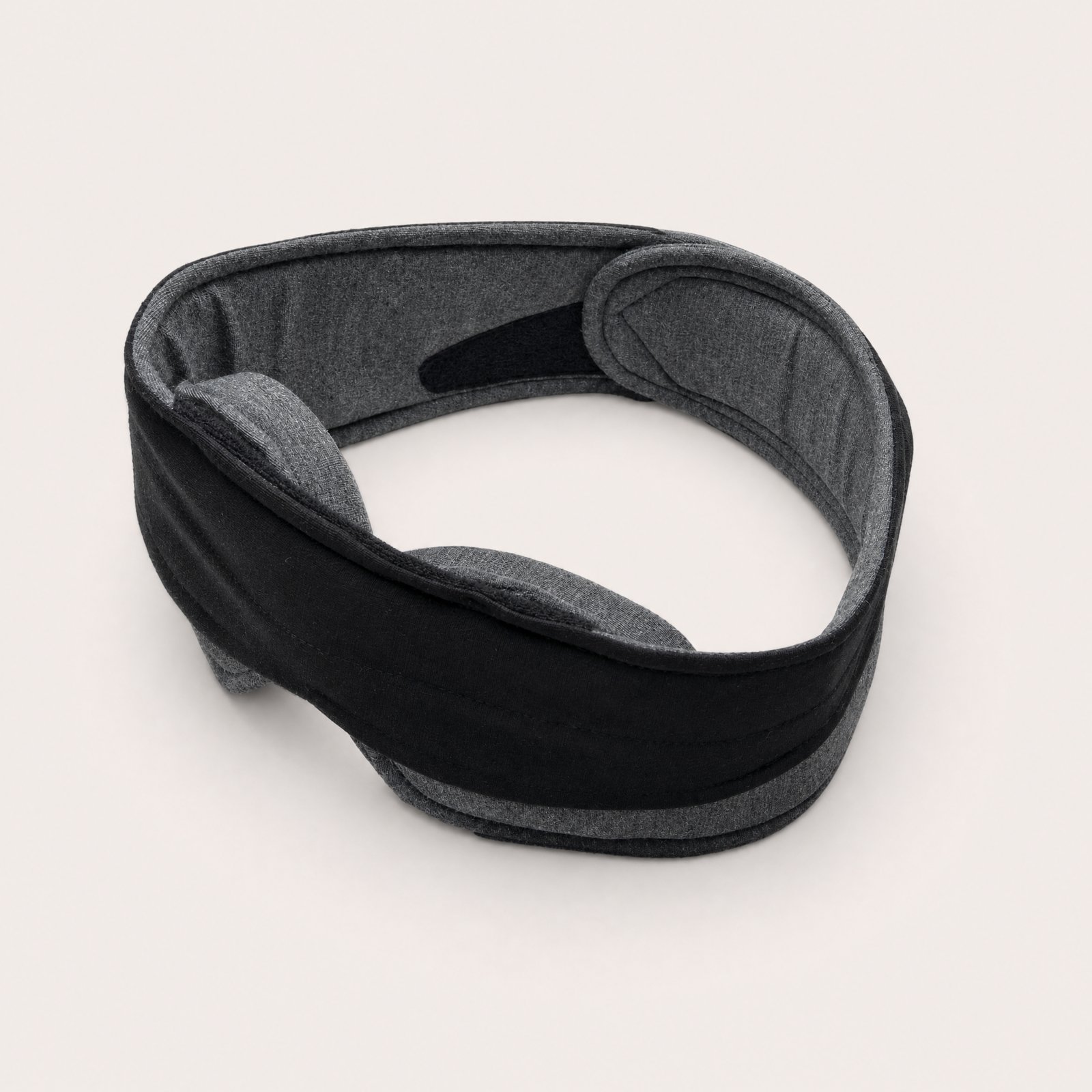 NODD Blackout Sleep Mask in black, closed in a loop